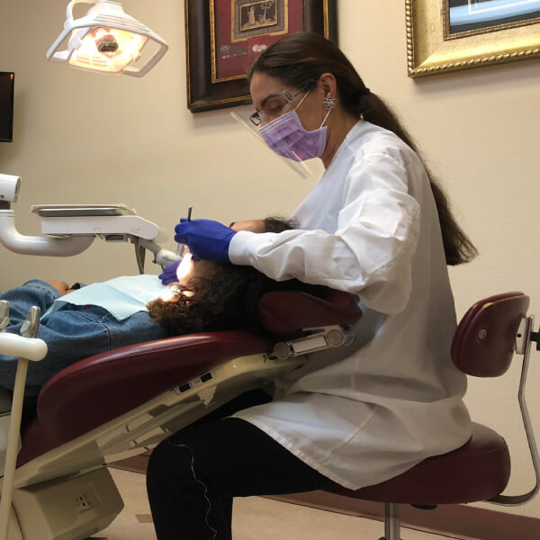 Image of Doctor Isaqi Working on Patient